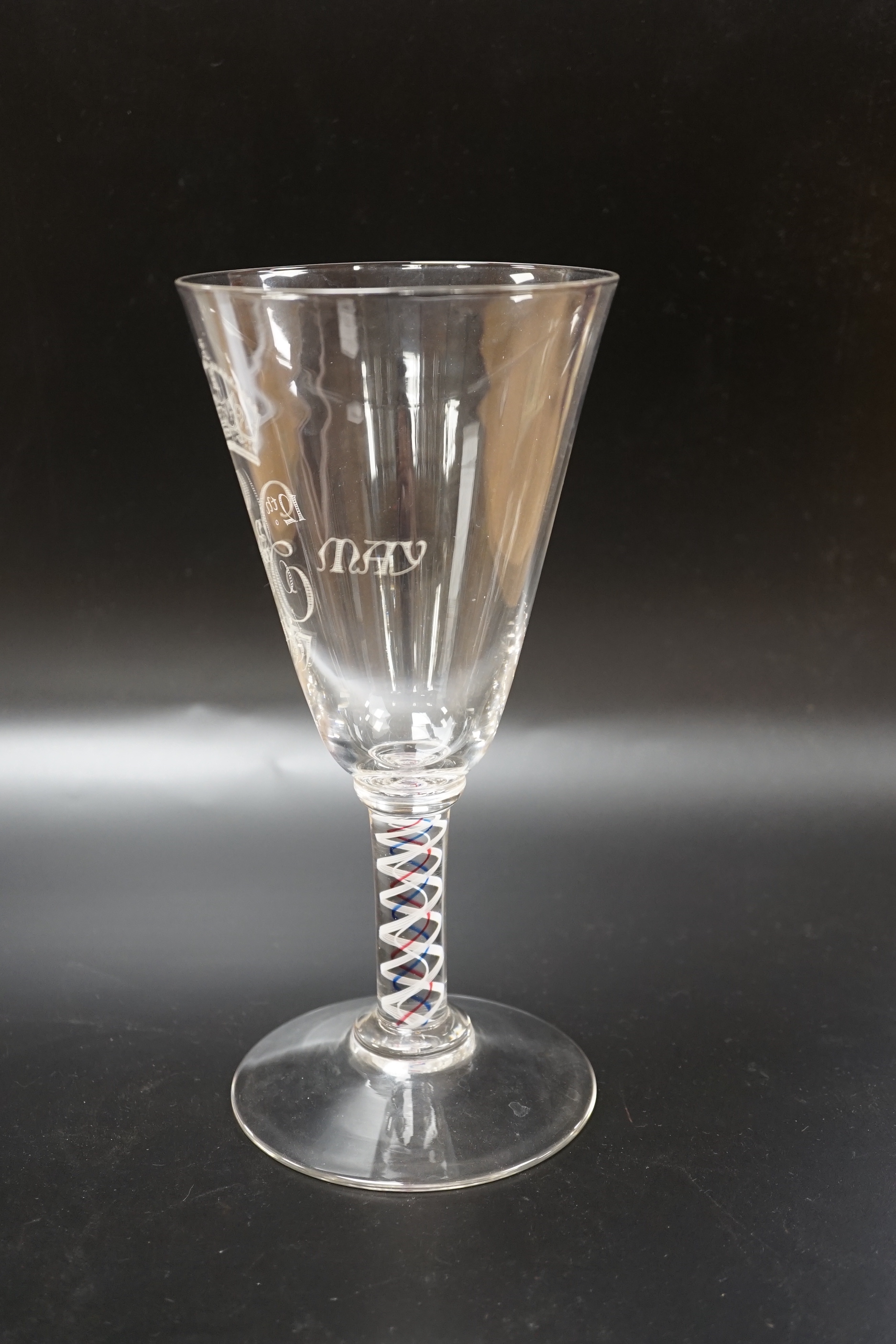 A large George VI commemorative trumpet goblet with etched glass design and cypher dated 1937, stem with red, blue and white colour twist, 22.9cm high